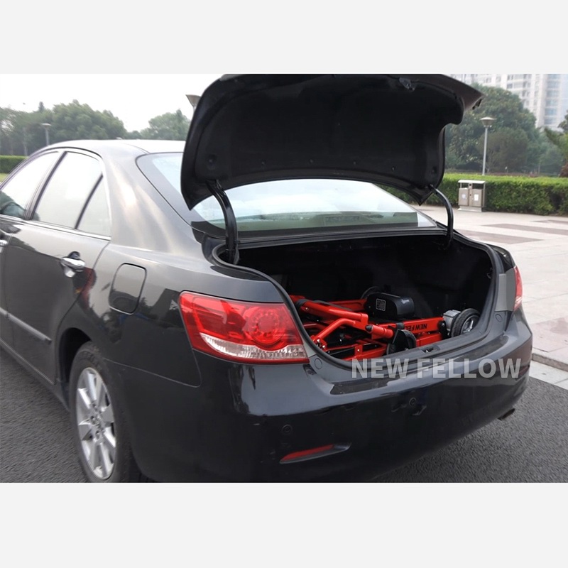 The climbing chair is folded and placed in the trunk of the car